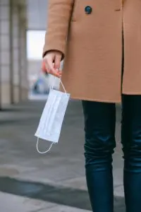 Lady holding a mask