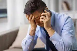 Stressed out man on the telephone