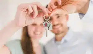Homeowners holding their new keys