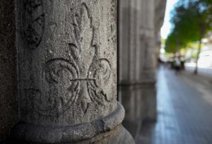Fleur De Lys cut into a stone pillar