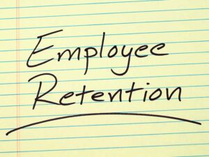 Employee Retention underlined on a piece of lined paper