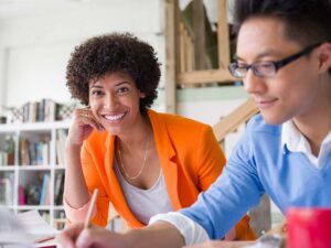 Two business people working on a mentoring project together