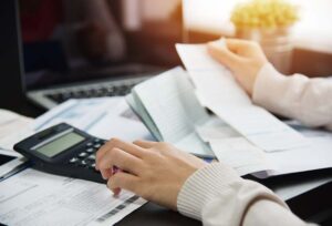 Woman at her desk doing her GST taxes