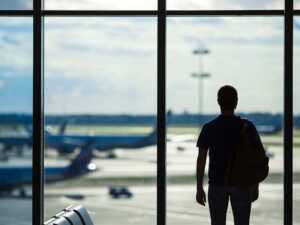 Silhouette of a man waiting to board a flight