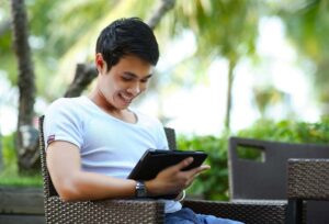 A relocation partner looking on his tablet