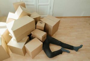 A mover buried under a pile of boxes