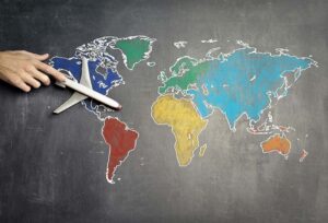 World map with a small model plane